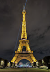 Eiffel Tower sparkles at night