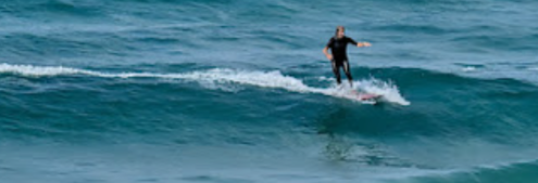 Surfer in Gros district
