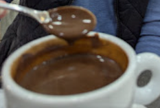 Cup of chocolate for dipping churros