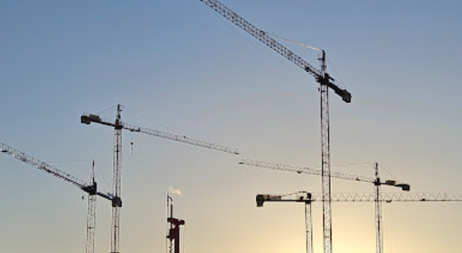 Skyline of construction cranes