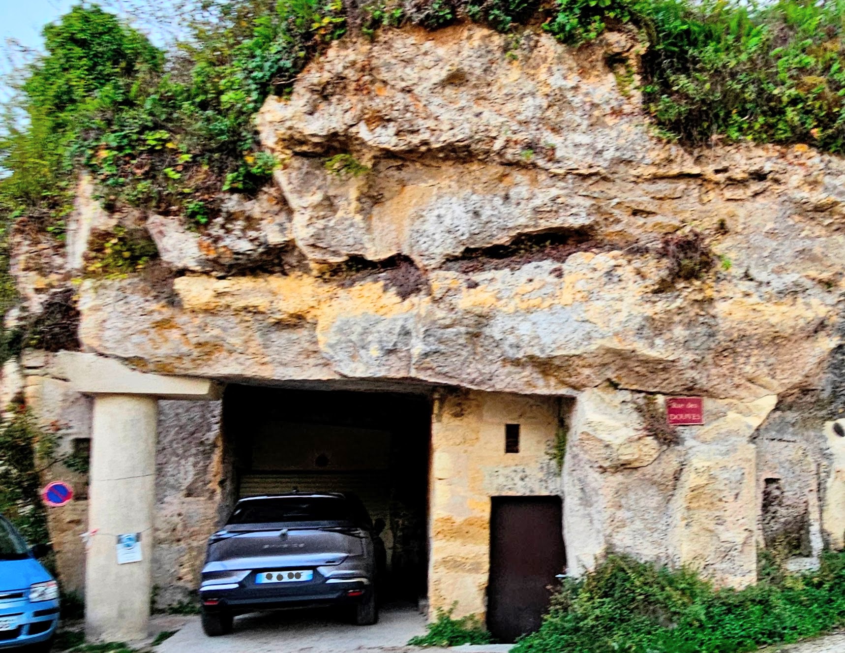 Garage carved into stone cliff