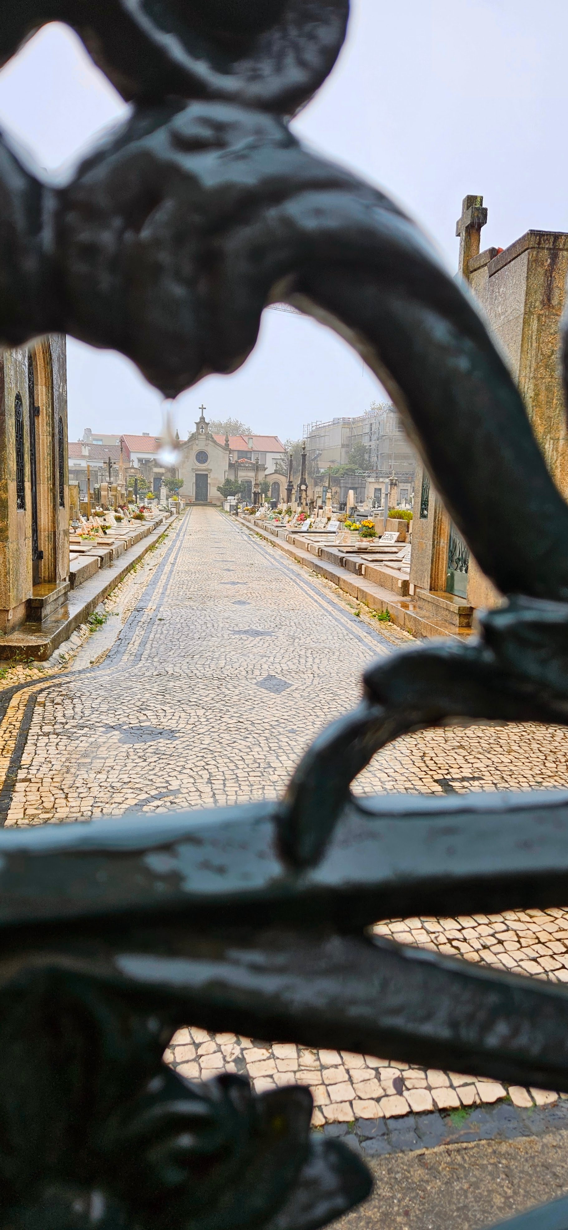 Chapel and cemetary seen through gate in Foz District