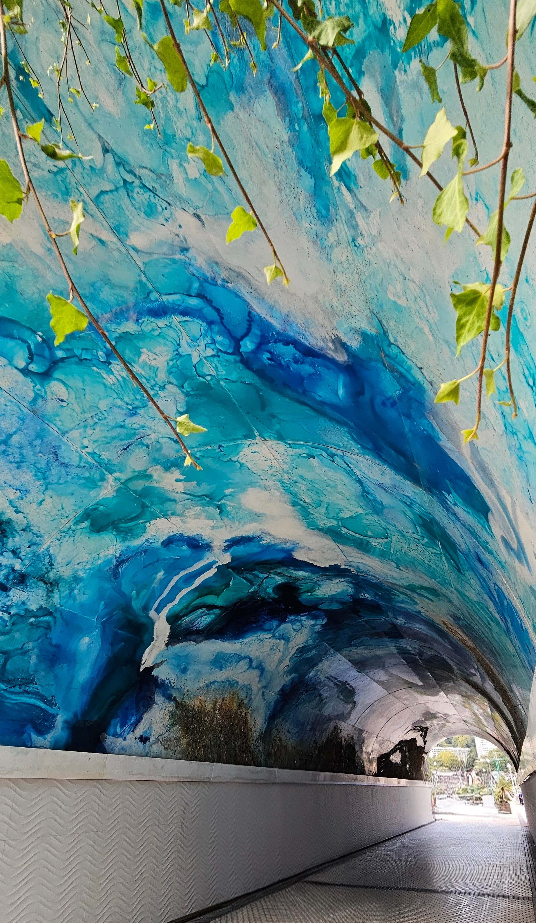 Glazed art ocean scene roofing a roadway underpass