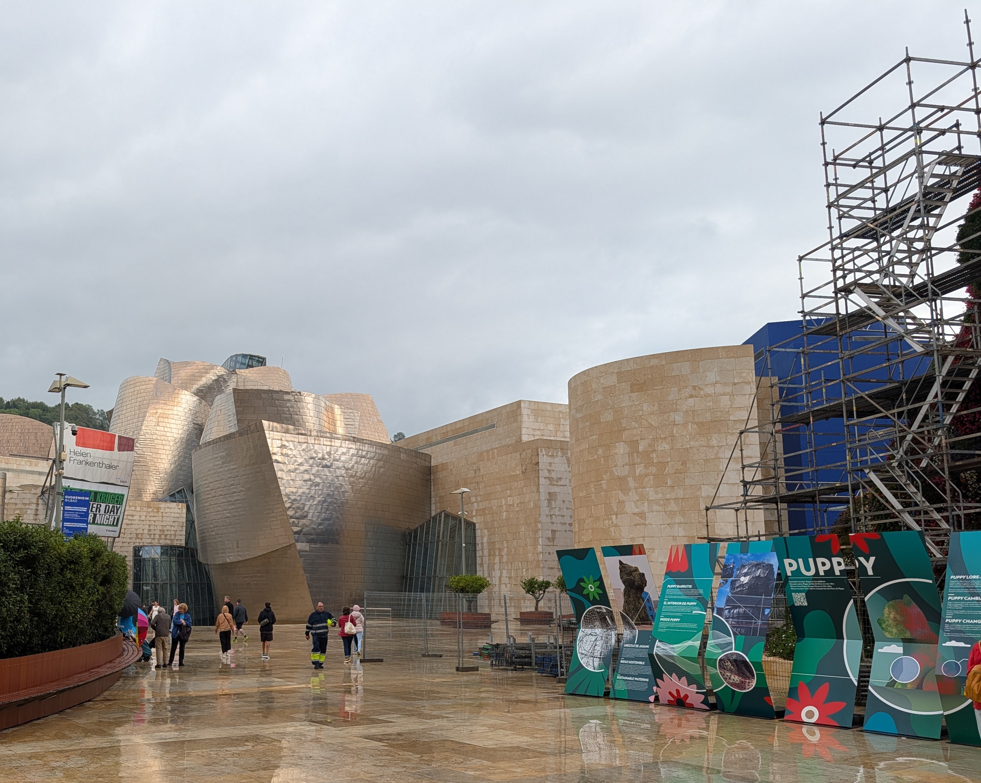 Guggenheim entry and Puppy sculpture surrounded by scaffolding