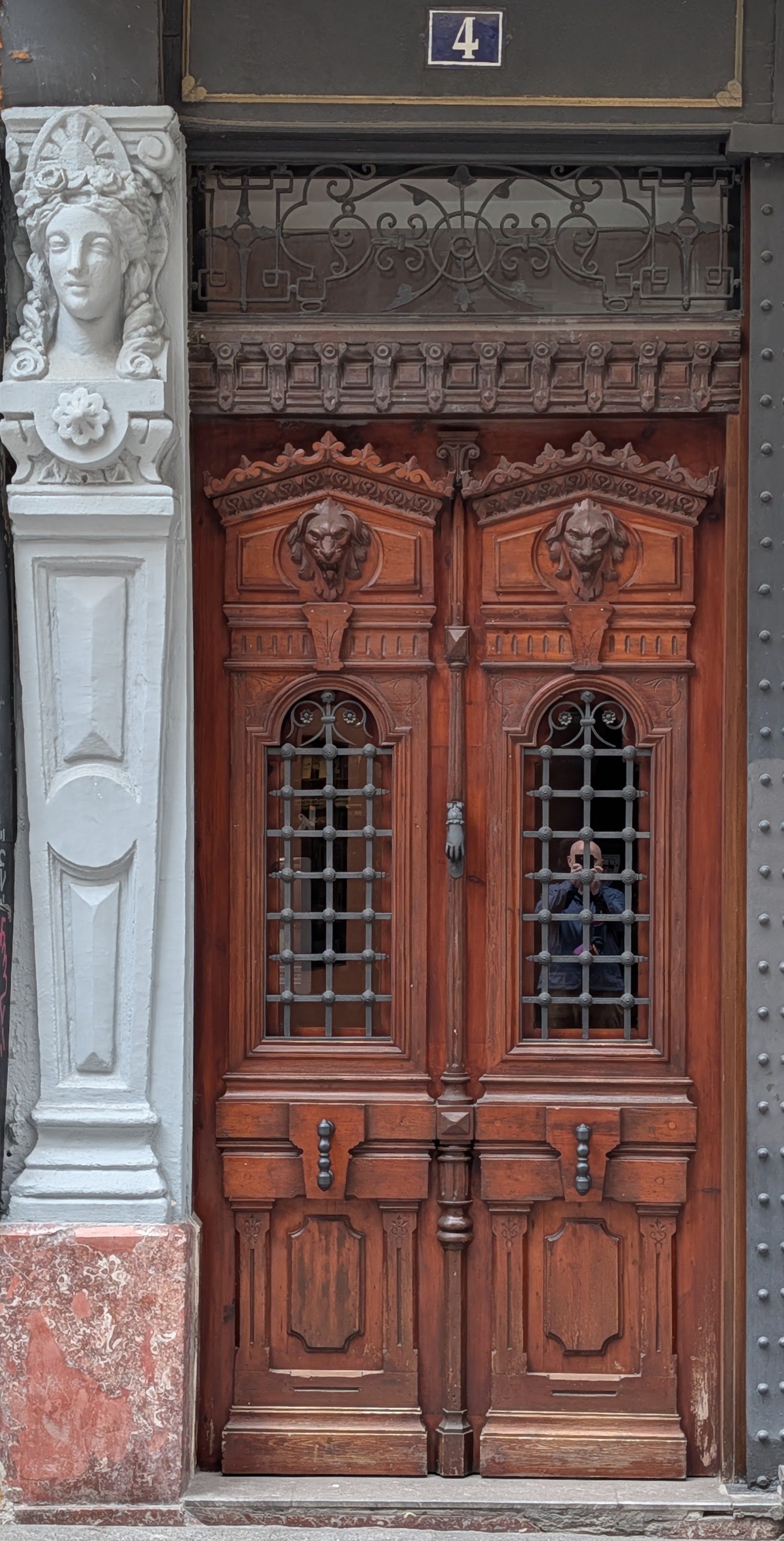 Wooden door with grated windows
