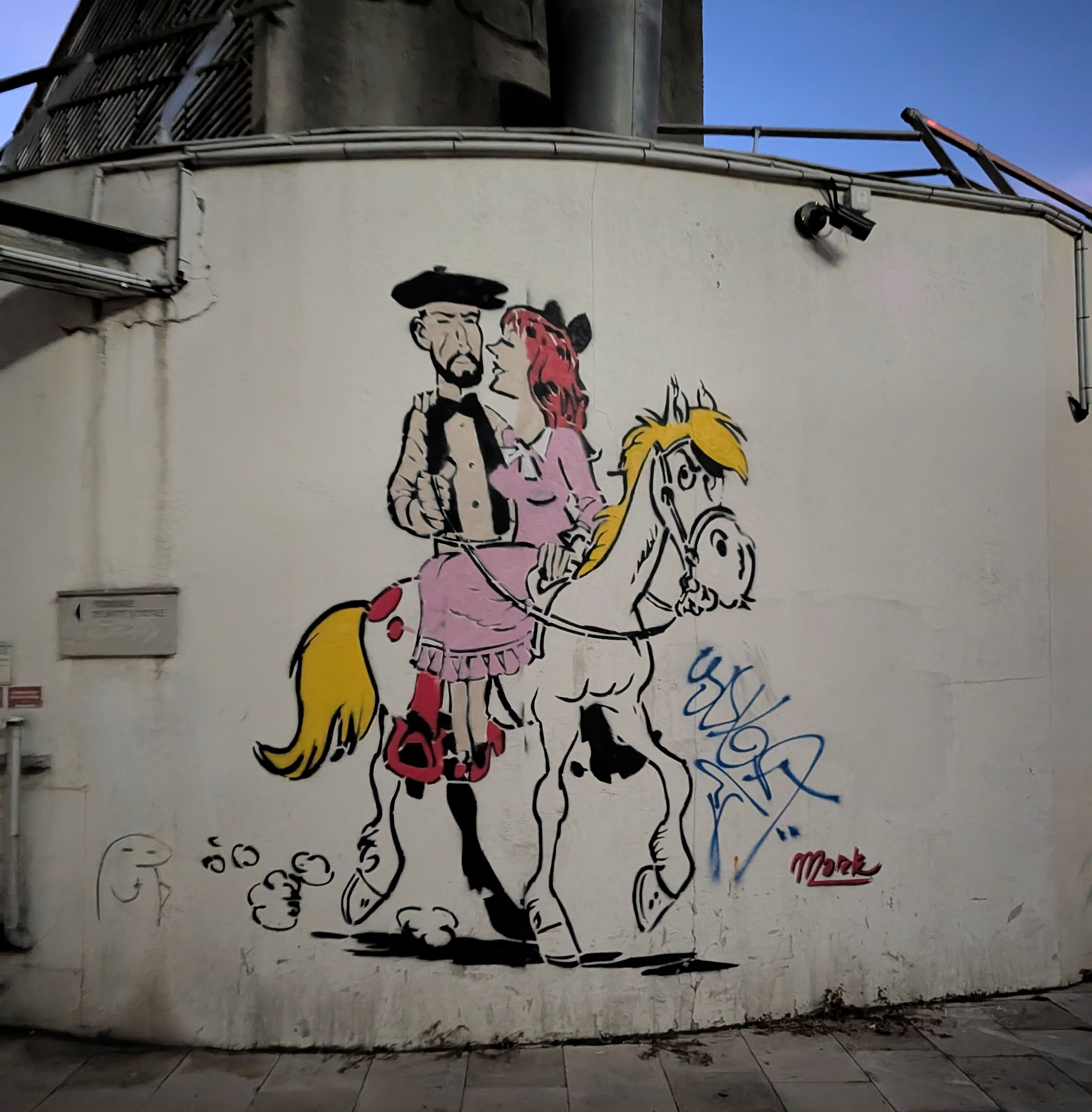 Man and lady on a horse cartoon street art
