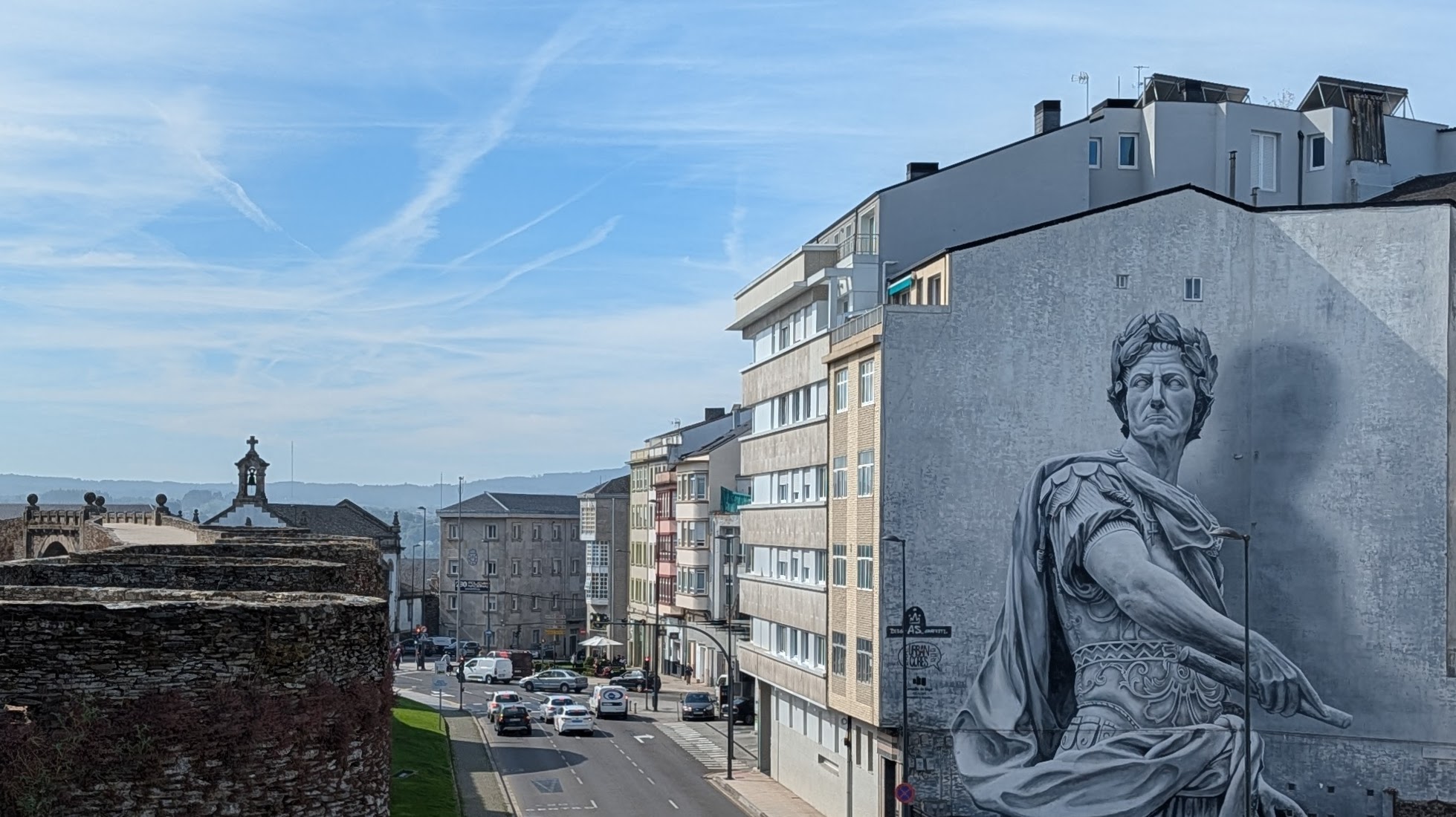 Mural of emperor seen from atop the Roman wall in Lugo