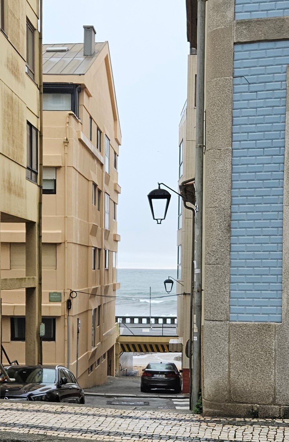 Beach seen through buildings in the Foz District