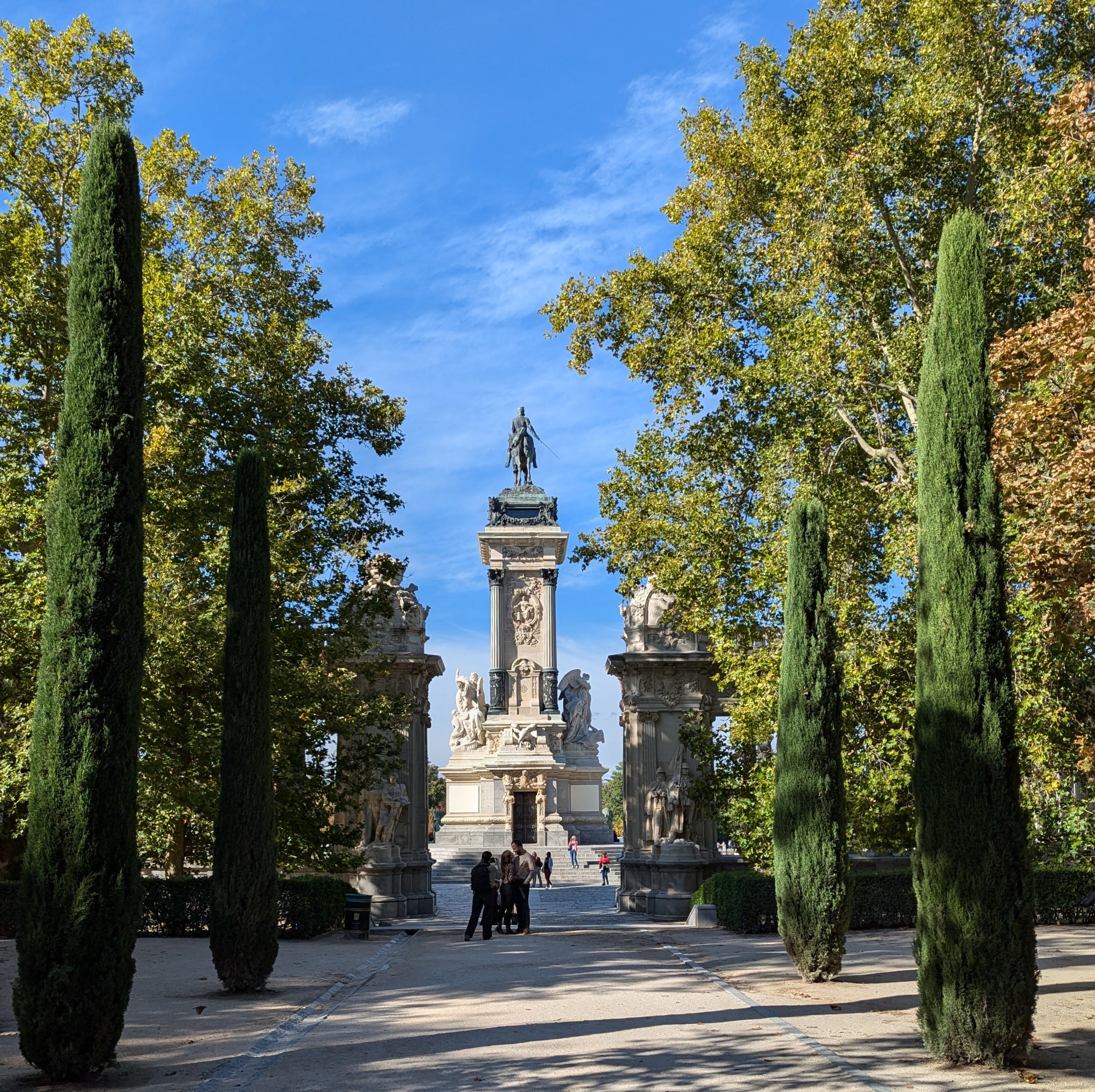 Monument at end of cypress colonade
