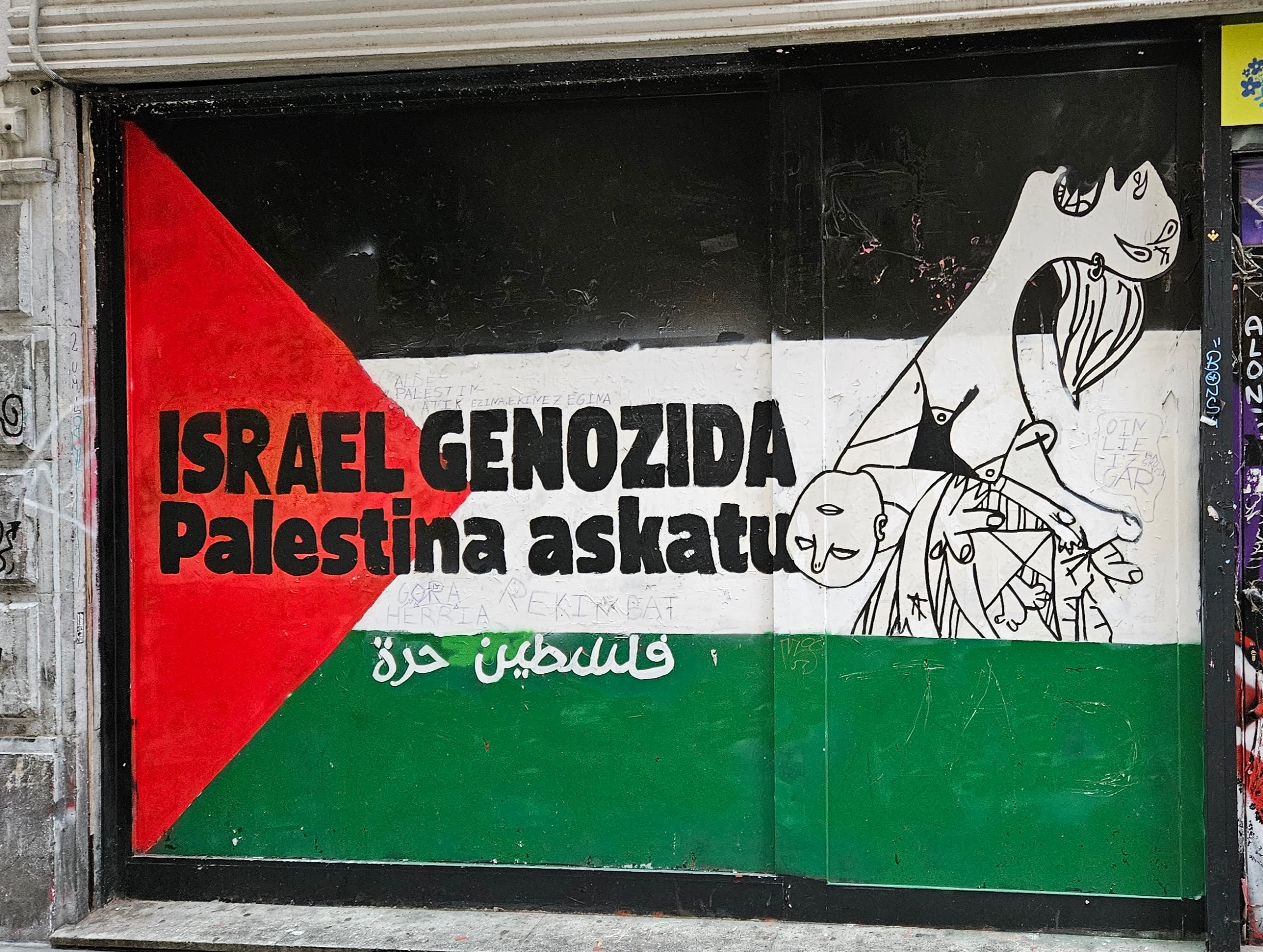 Street art showing support for Palestine featuring a snippet from Picasso's Guernica